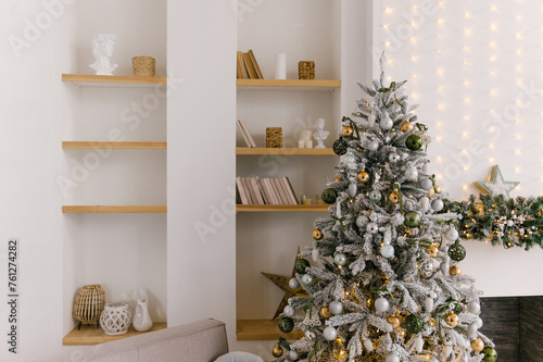 Obraz na płótnie Beautiful minimalistic interior, bookcase with books and decor, Christmas tree and fireplace w salonie