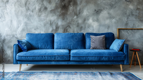 
Blue velvet sofa in a modern minimalist interior with a concrete wall, Monstera plants, and stylish lighting. Generative AI.