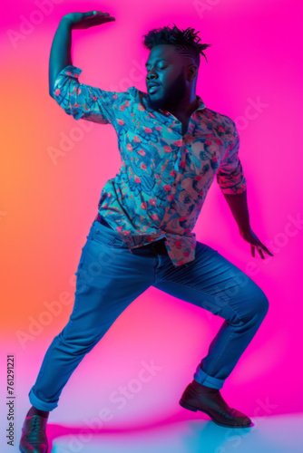 Confident Plus-Size Individual Dancing in Colorful Attire Against Pink Background