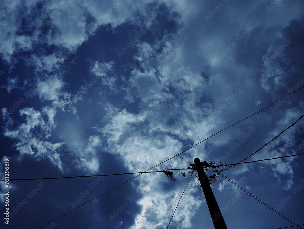 Silhouette of electric pole under the sky Silhouette of electric pole under the sky