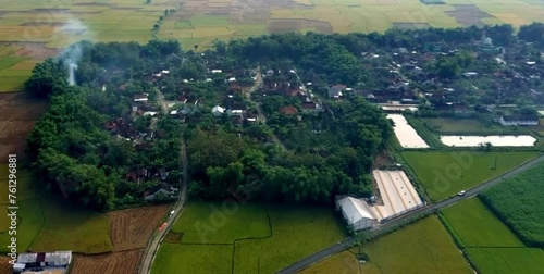 aerial video of agricultural land and rice fields that spread widely in the rural lowlands