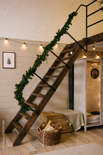 Obraz na płótnie Interior design of a duplex apartment with a metal staircase decorated for the new year w salonie