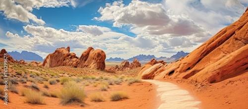 Valley of Fire State Park against a bright blue, cloudy sky © GoDress