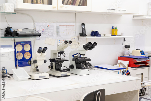 Well-equipped lab station with microscopes and scientific resources