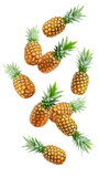 Falling pineapple isolated on white background, full depth of field