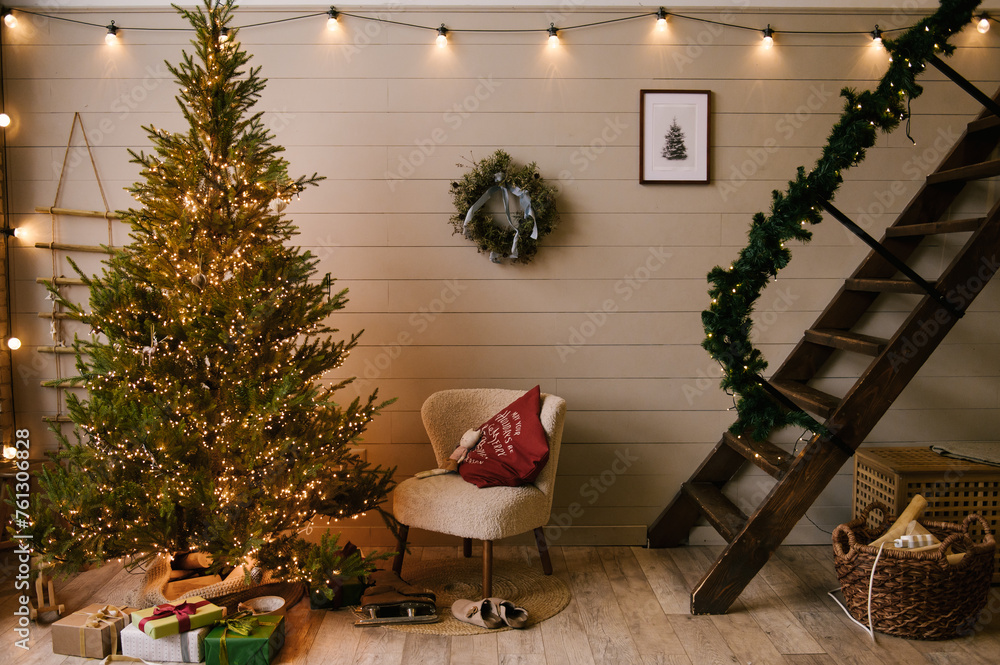 Beautiful New Year decor in a stylish interior with a Christmas tree, wreath and gifts