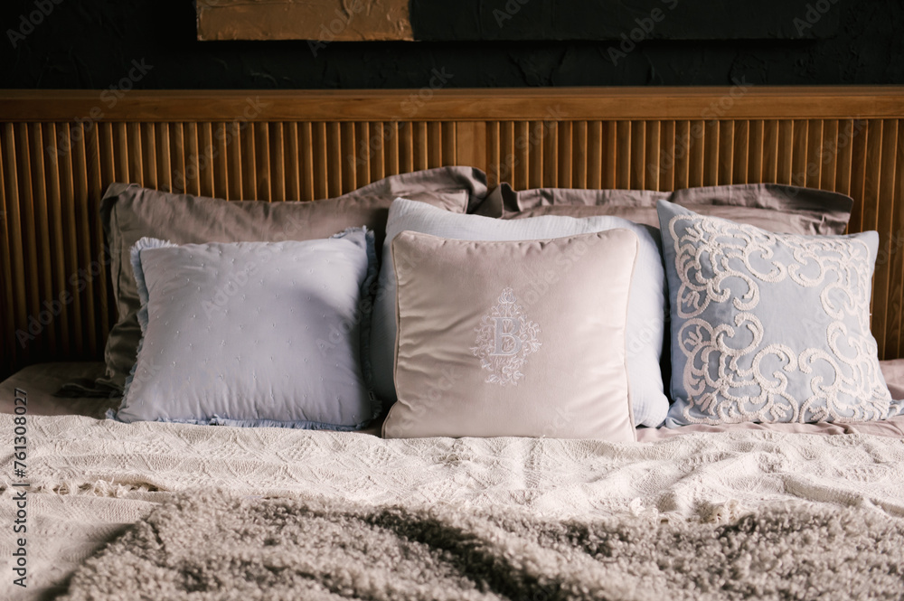 Stylish modern japandi interior, wooden bed with beautiful textiles