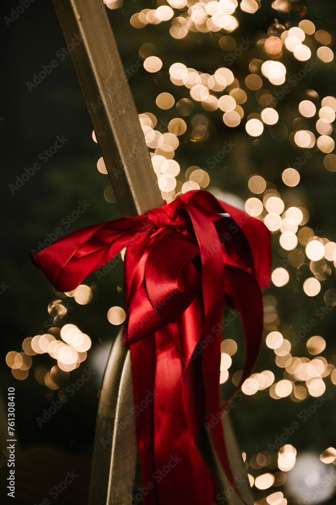 Beautiful New Year decor, red bows close-up, selective focus