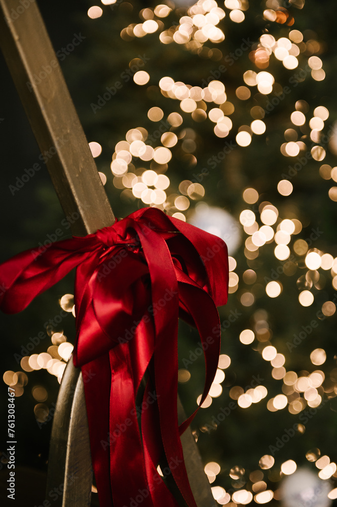 Beautiful New Year decor, red bows close-up, selective focus