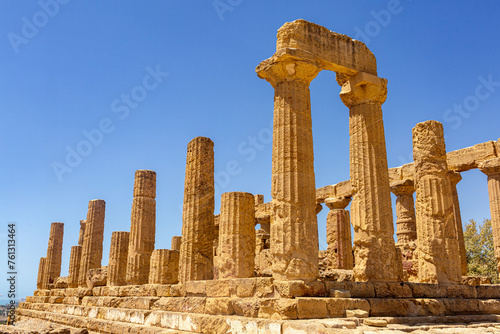 Columns of Temple of Heracles. The Valley of the Temples in Agrigento, archaeological heritage. Hellenic, Greek architecture in Sicily, Italy, famous tourist place, no people. August 2023. photo