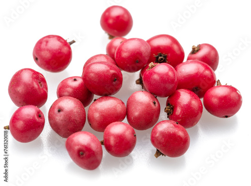 Fresh pink peppercorns isolated on white background. photo