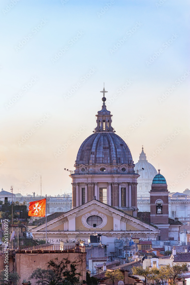 Basilica San Carlo al Corso in Rome. Dusk falls on Rome's San Carlo al Corso church, its dome and cross catching the fading light. Rome, Italy