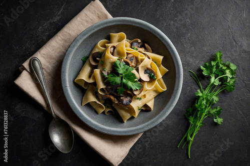 Mushroom pasta pappardelle with cream sauce and parsle photo