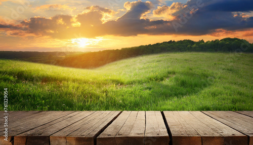 Wooden Planks and Sunset Over Grass Field Landscape Background