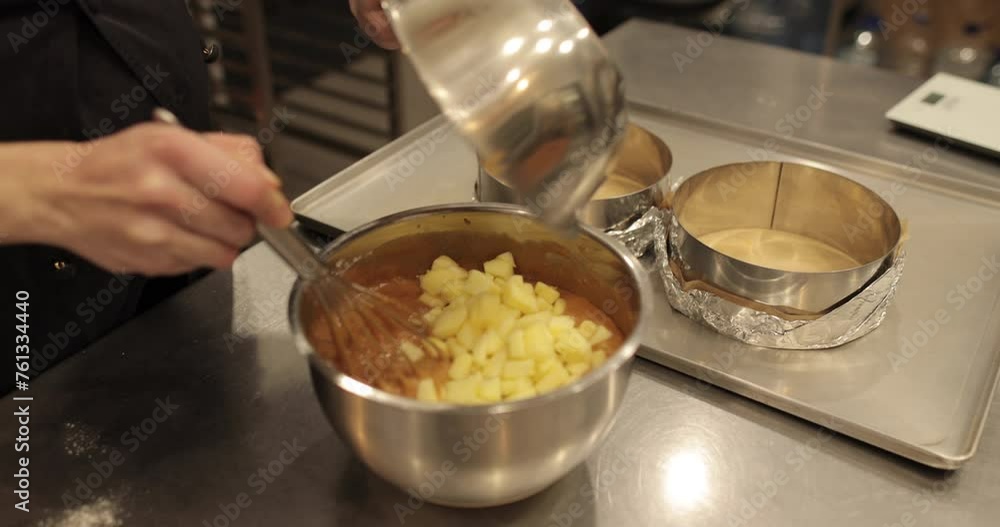 The process of preparing cream, mousse, filler in a metal bowl. Mixing and whisking the ingredients in a bowl. The process of preparing cream, mousse, filler in a metal bowl. Mixing and whisking the ingredients in a bowl.