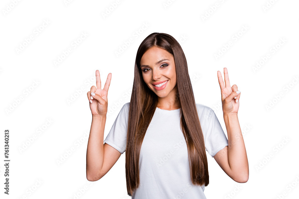 Portrait of brown-haired gorgeous attractive nice smiling young lady with long hair over grey background, showing double v-sign gesture, isolated Portrait of brown-haired gorgeous attractive nice smiling young lady with long hair over grey background, showing double v-sign gesture, isolated