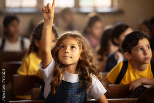 Girl is raising her hand in classroom