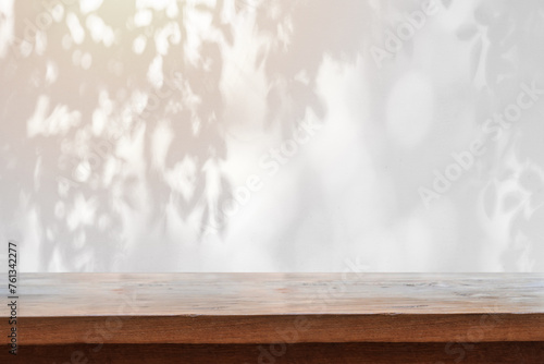 Abstract black and white Shadow of leaves background and textured with empty table top © Kittiphan