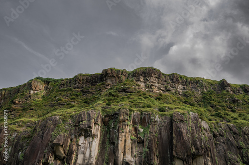 amazing great cliff standing on the coastline, like a big stunning castle, cloudy day, in Keelung, Taiwan.