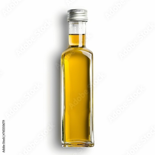 A clear glass bottle filled with light yellow olive oil rests on a white background. The bottle has a cork stopper and a label.