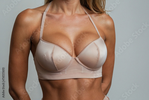 Close-up of sexy breasts in bra. Woman's breasts or big natural boobs in lingerie. Plastic surgery