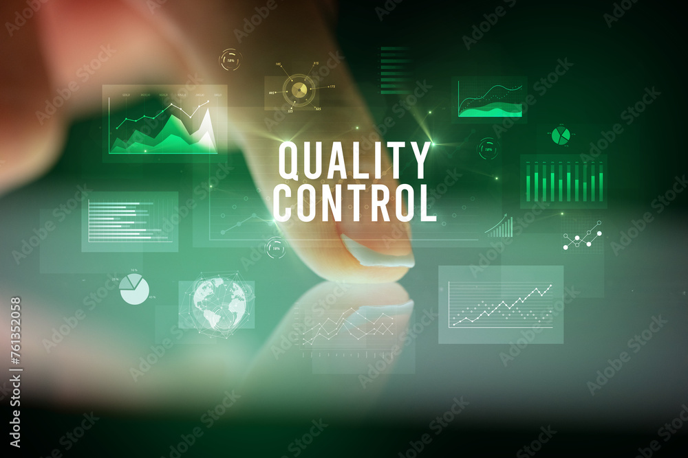 Finger touching tablet with business graphs and icons concept Finger touching tablet with business graphs and icons concept
