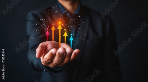 arrow icon on hand showing interest rate, a businessman showing graph with investment growth. business and financial graph chart on hand, marketing, management, 