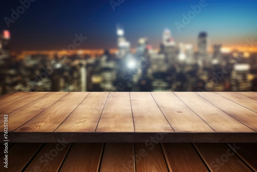 image of wooden table in front of abstract blurred background of city night lights. buildings and skyscrapers.