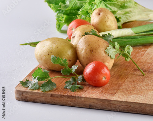 Fresh mix vegetables including potatoes, coriander, tomato and spring onion