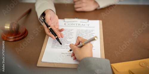 Company hired the lawyer office as a legal advisor and draft the contract so that the client could signs the right contract. Contract of sale was on the table in the lawyer office