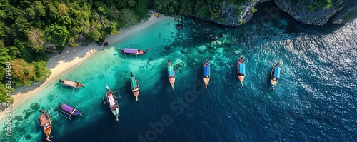 Aerial drone view of long tail touristic boats docked along the naked island photo