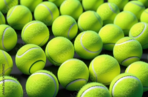 tennis ball on green grass © Leshtana