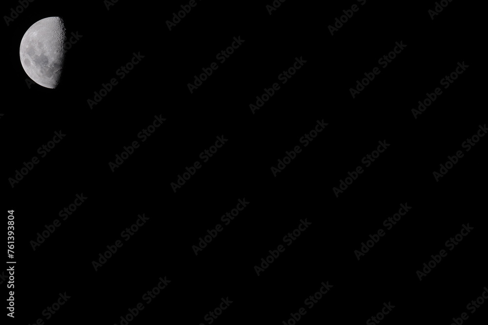 High resolution half moon photo on a uniform black background, which is ideal for use as a presentation slide template. The moon is located in the top left corner, which will be next to the title. High resolution half moon photo on a uniform black background, which is ideal for use as a presentation slide template. The moon is located in the top left corner, which will be next to the title.