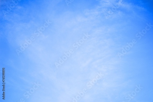 clear blue sky with light white clouds background