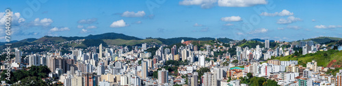 Expansive Cityscape with Buildings under Blue Skies