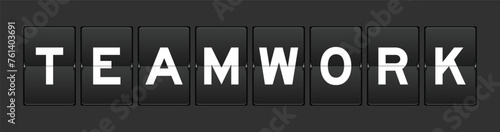 Black color analog flip board with word teamwork on gray background