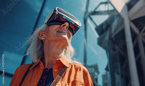 Attractive aged woman wearing virtual reality glasses outdoor