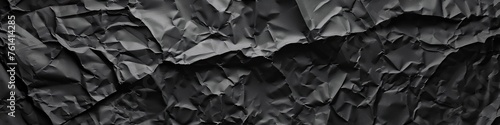 Uncover the allure of a single-colored crumpled paper texture background, rendered in deep black, offering a timeless elegance to your designs.