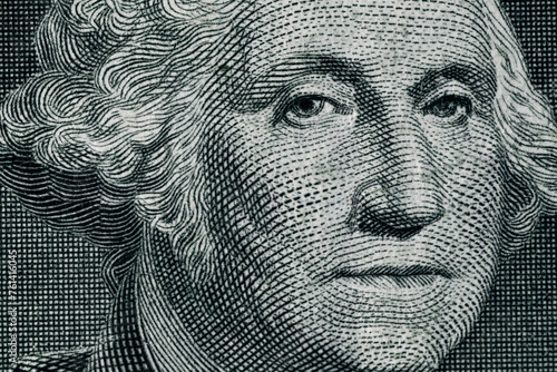 George Washington's face on a one dollar bill. United States national currency banknote fragment. George Washington portrait