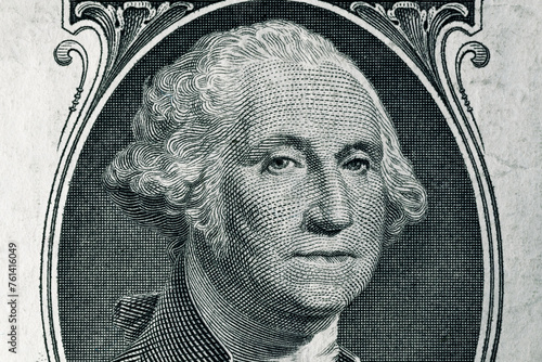 George Washington face in the frame on a one dollar bill. United States national currency banknote fragment. George Washington's portrait on the one dollar bill