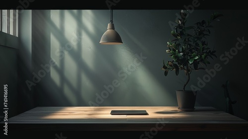 Minimalist home office with smartphone, plant, and hanging lamp