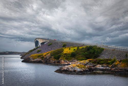 Storseisunbrau bridge with a dramatic sky showing the curve at the top of the bridge photo