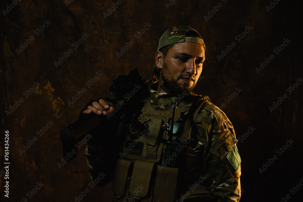 A Latin American soldier with a confident gaze stands with his rifle, outfitted in tactical combat gear A Latin American soldier with a confident gaze stands with his rifle, outfitted in tactical combat gear