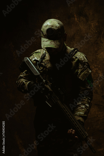 A shadow-enshrouded Latin American soldier stands with his rifle, exuding a silent strength and determination
