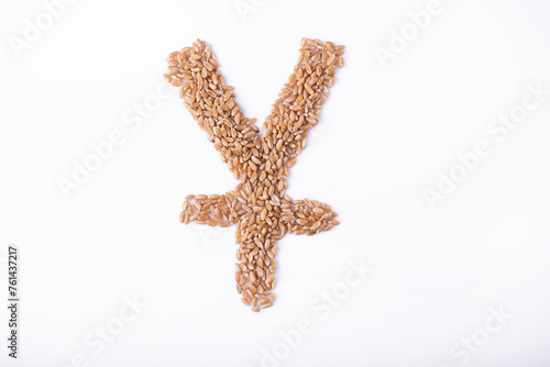 Chinese Yuan and Japanese Yen sign made of grain on a white background. The concept of the grain crisis and the development of the eastern economy