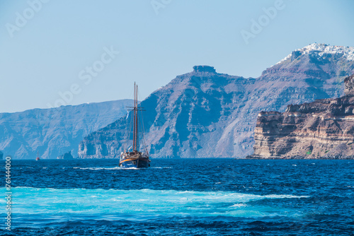 tourist vintage sailing yacht in the Aegean sea near the coast of Santorini island in Greece 