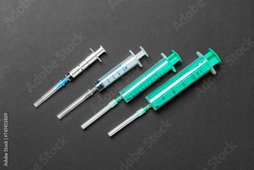 Top view of medical syringes on colorful background. Health care concept with copy space