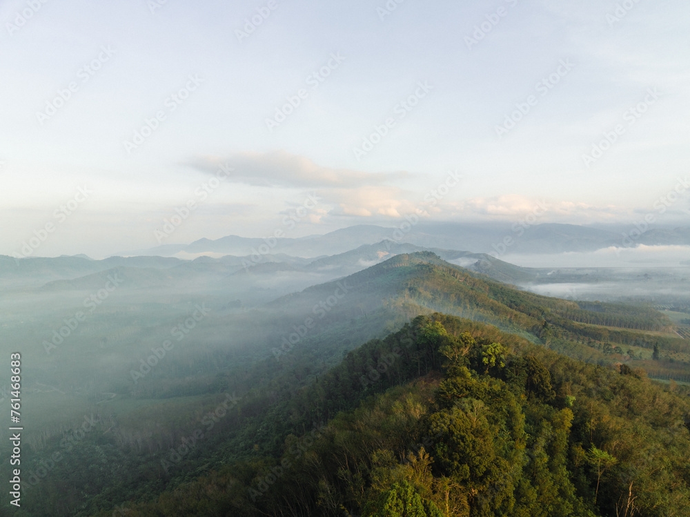 Aerial mountain peak sunrise tropical rainforest sky with cloud