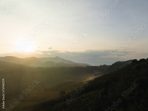 Aerial mountain peak sunrise tropical rainforest sky with cloud