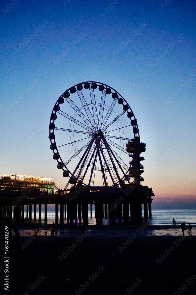Ferris wheel on pier at night